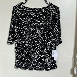 Black and white patterned peplum stretch blouse